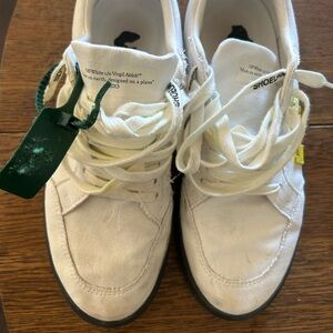 Off White tennis shoes with box. Gently worn. Dog chewed the tag.